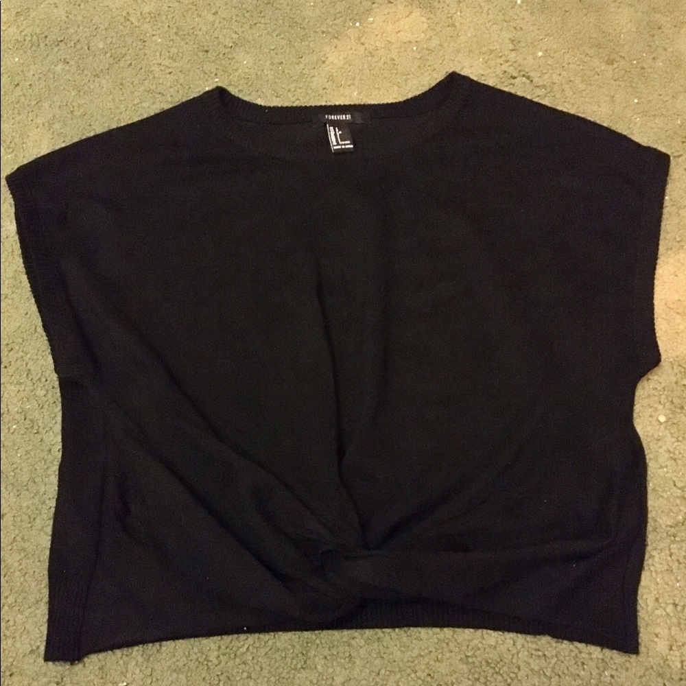A black crop top with a knot in the front
